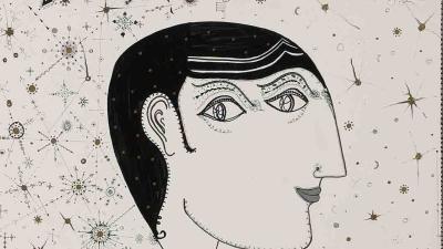 Стилізований портрет чоловіка в профіль з геометричною стрижкою, в чорному одязі прикрашеному фантастичною рибою.